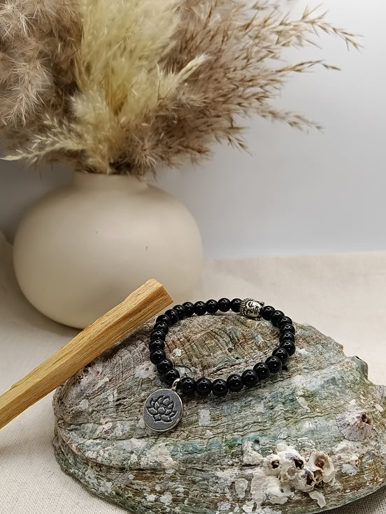 Bracelet Onyx O'NAIA Palo Santo lithothérapie stabilité force intérieure ancrage chakra racine
